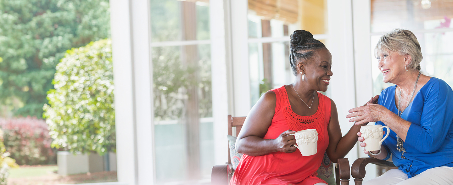two women on the porch talking